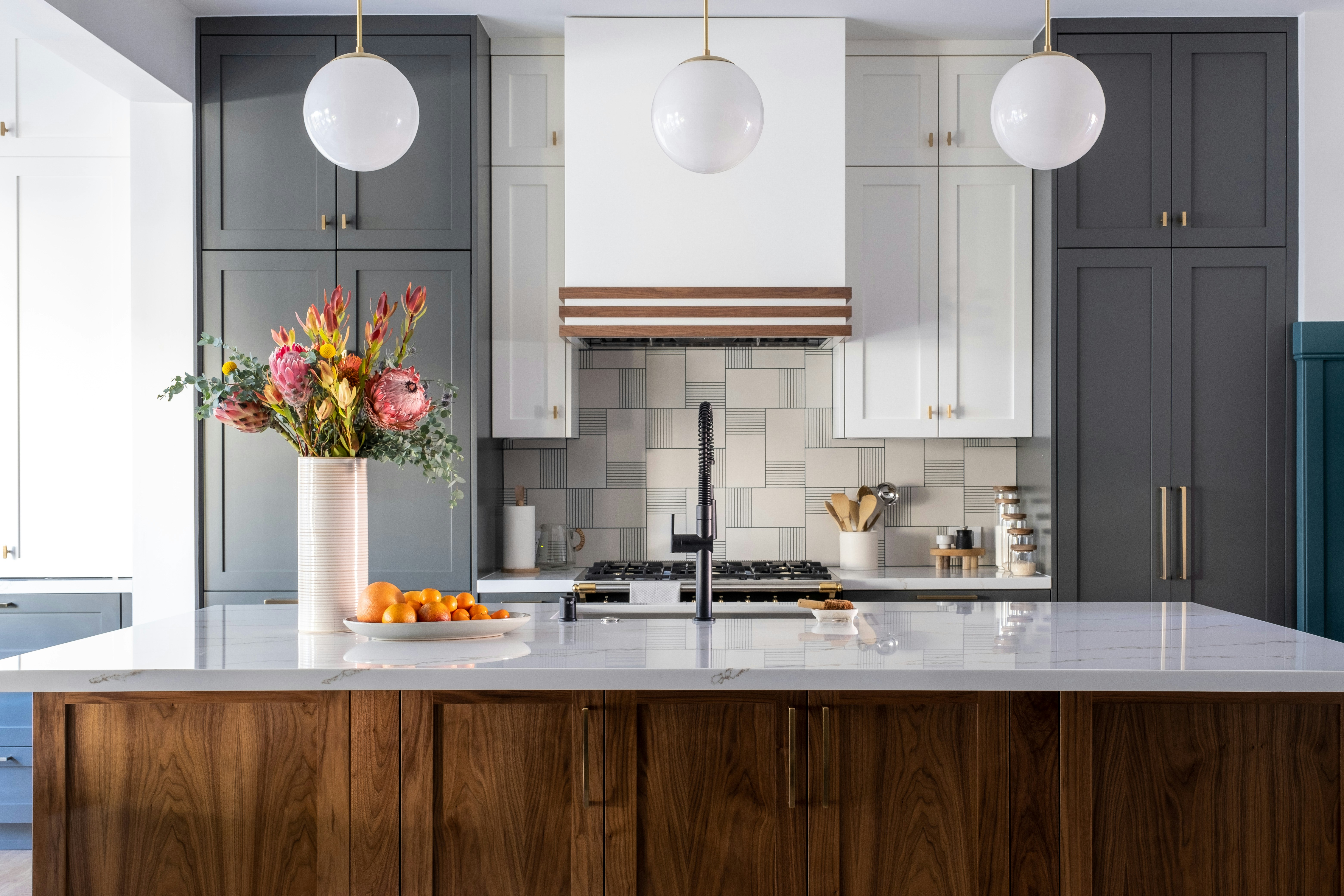 Completed custom kitchen with walnut cabinetry and dark built-ins