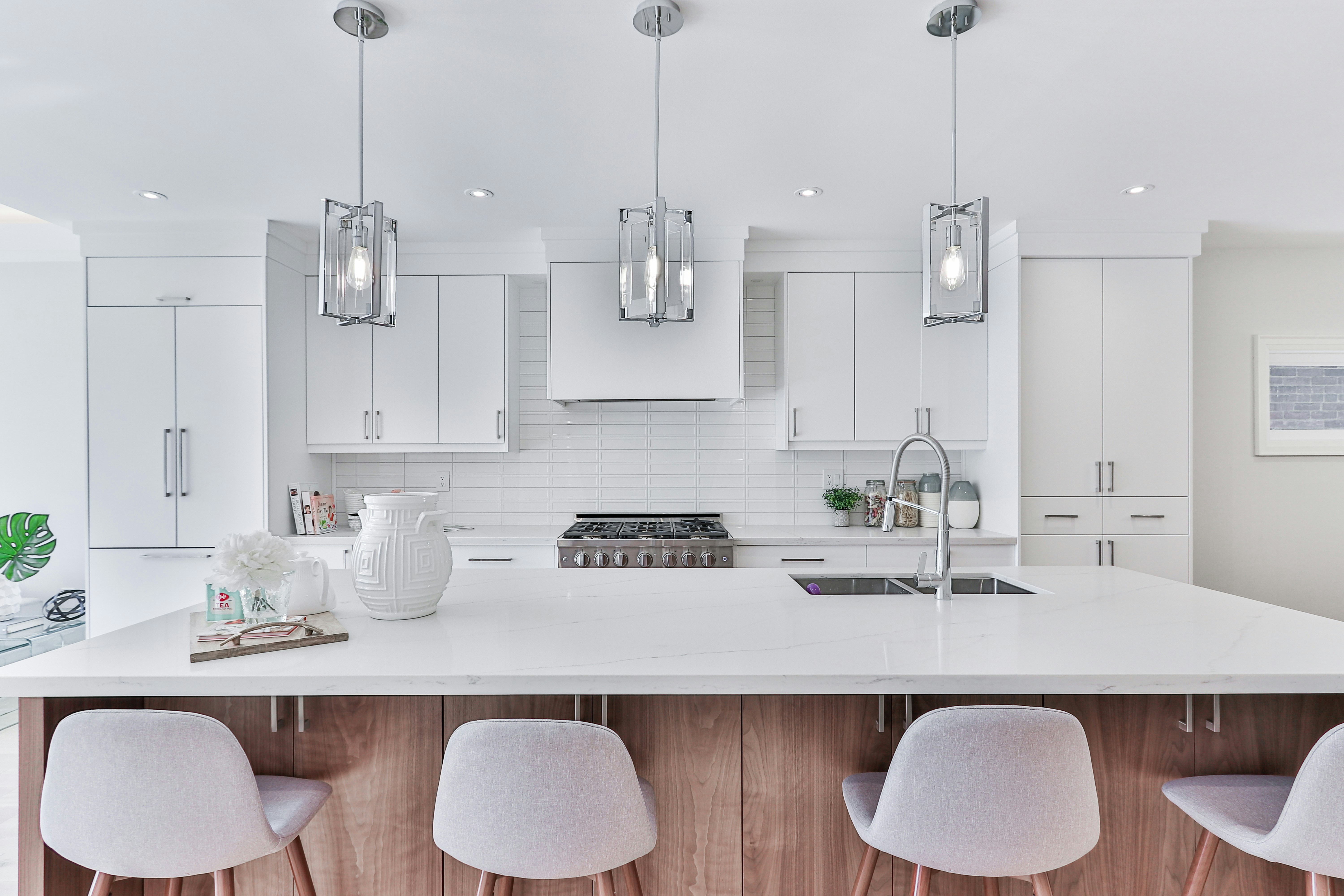 Completed bright white kitchen with custom cabinetry